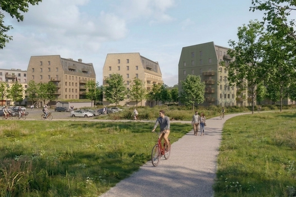Några personer som cyklar på trottoaren.